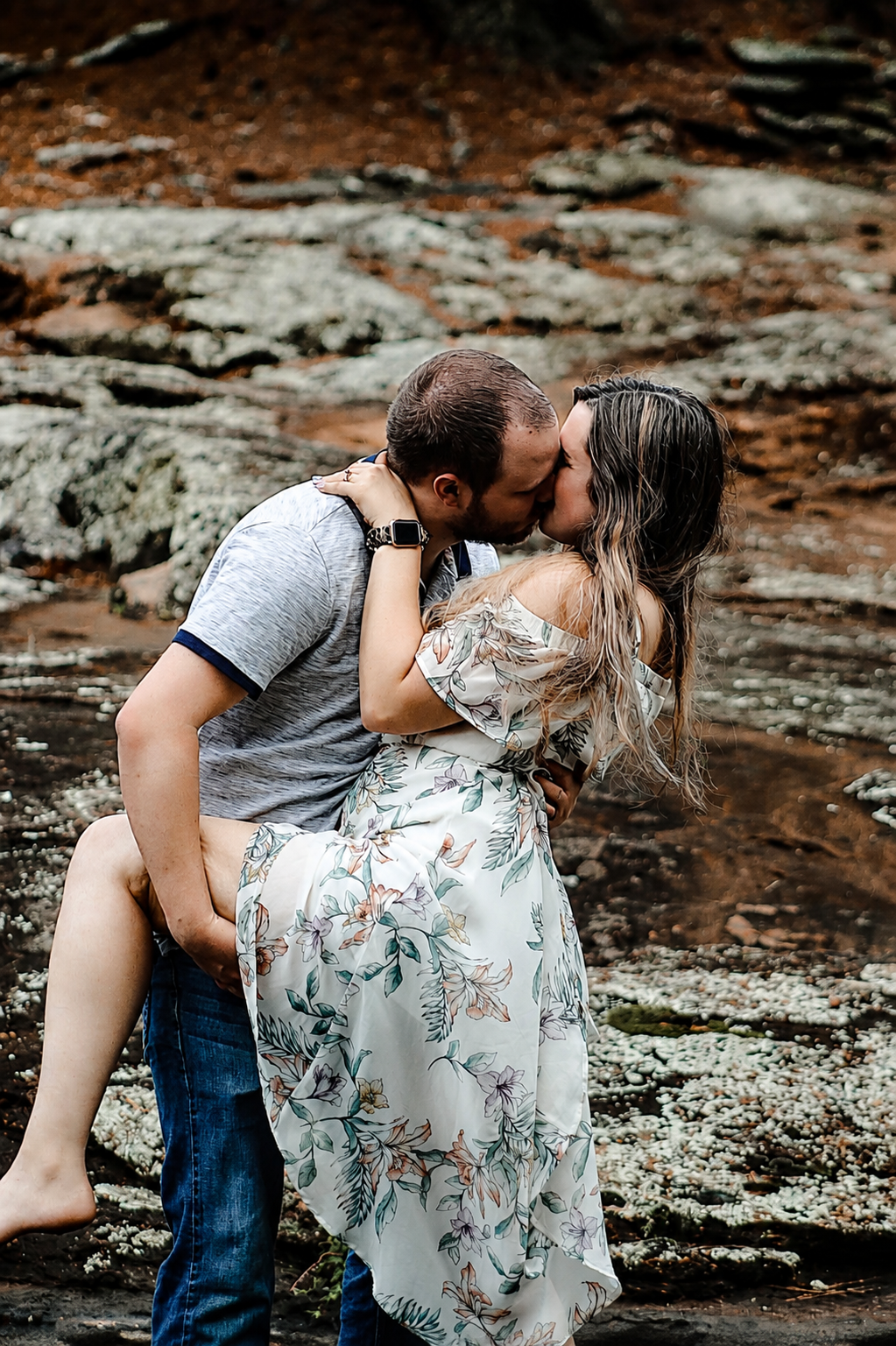 Couple kissing under a scenic waterfall during a couples portrait session – Shine Again Photography Newnan GA