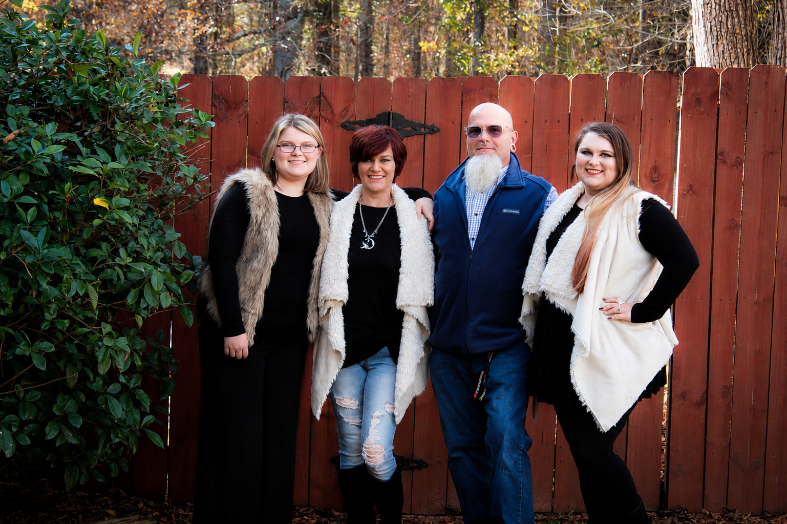 Family of four outdoors by rustic wooden fence – Shine Again Photography Newnan GA