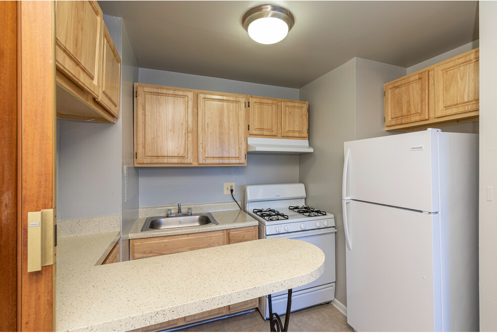 Studio kitchen with full stove and sink