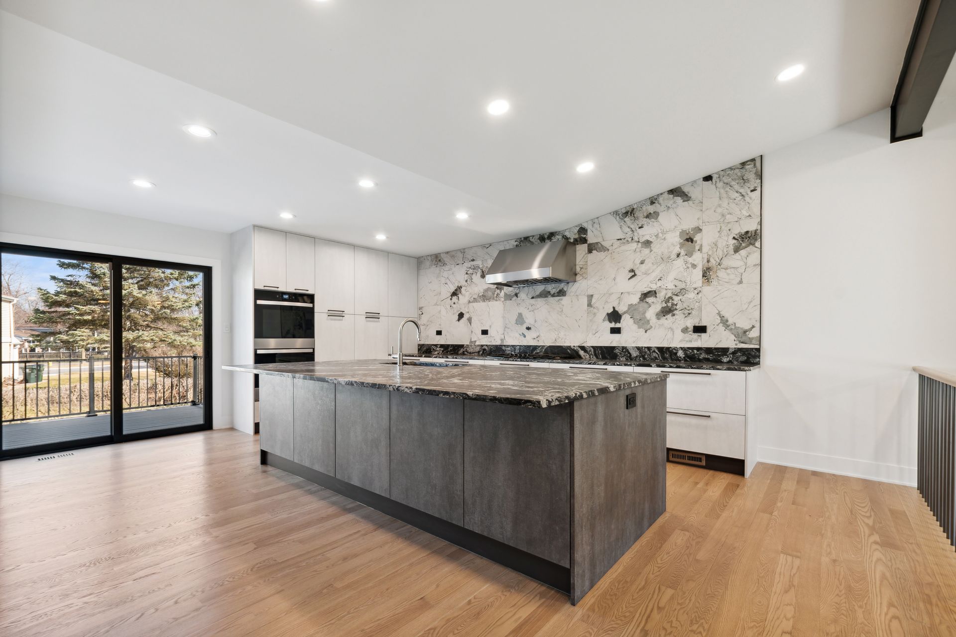 There is a large island in the middle of the kitchen.