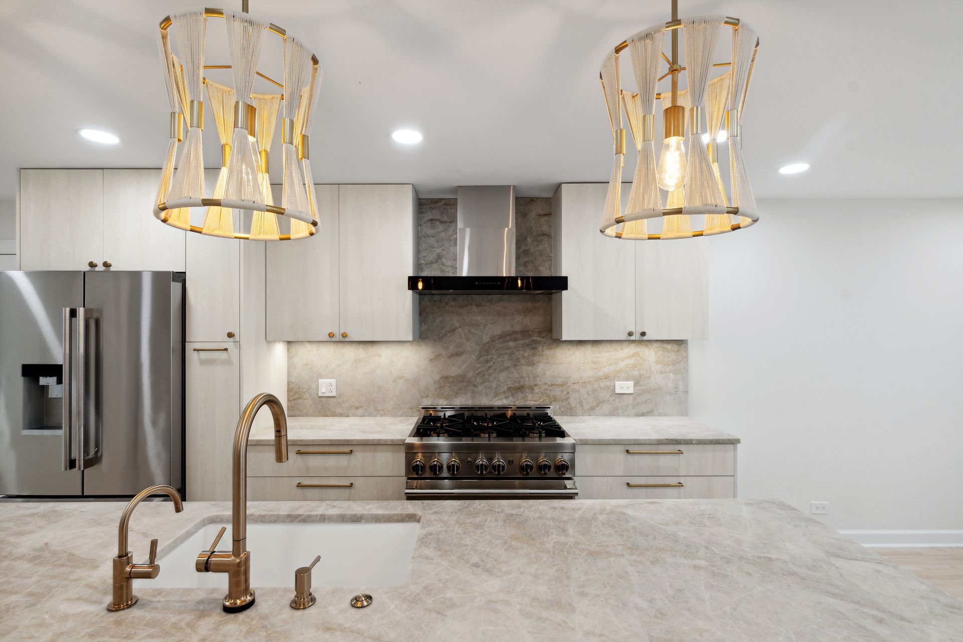 A kitchen with stainless steel appliances and white cabinets