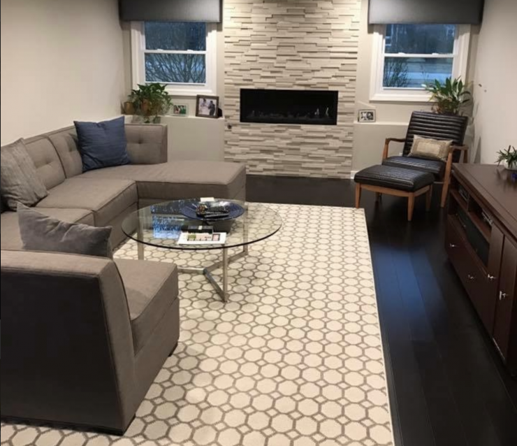 A living room filled with furniture and a fireplace