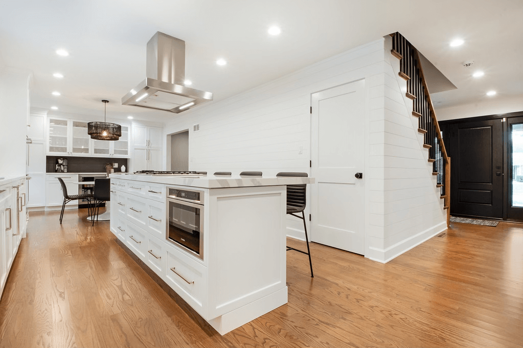 There is a large island in the middle of the kitchen.