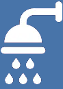 A white shower head with water drops falling from it on a blue background.