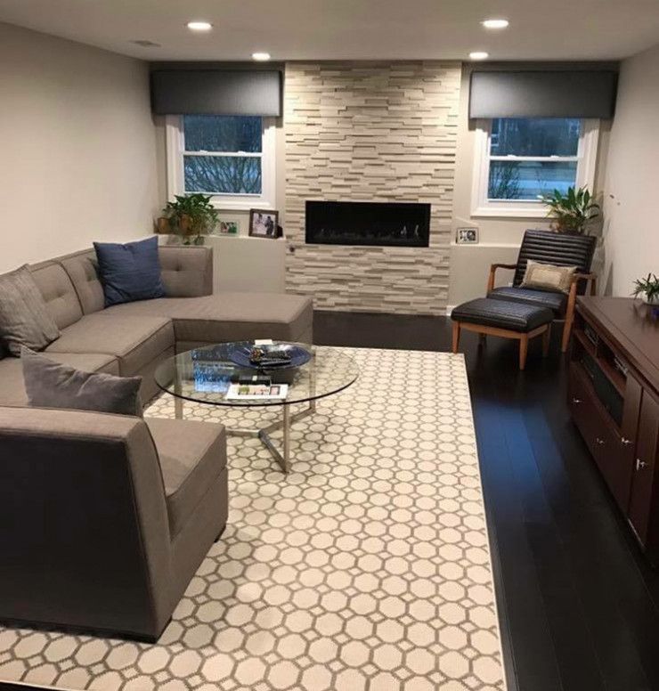 A living room filled with furniture and a fireplace
