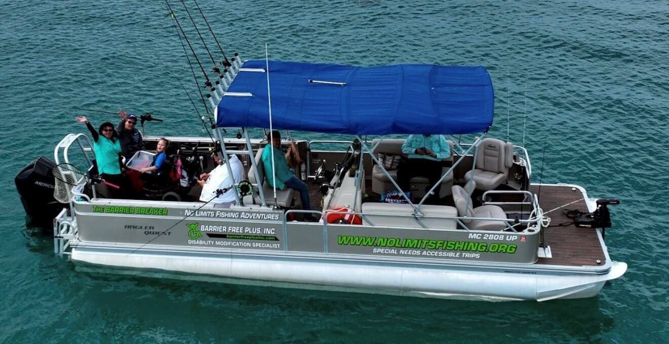 Pontoon boat with people fishing; blue awning, ocean background.
