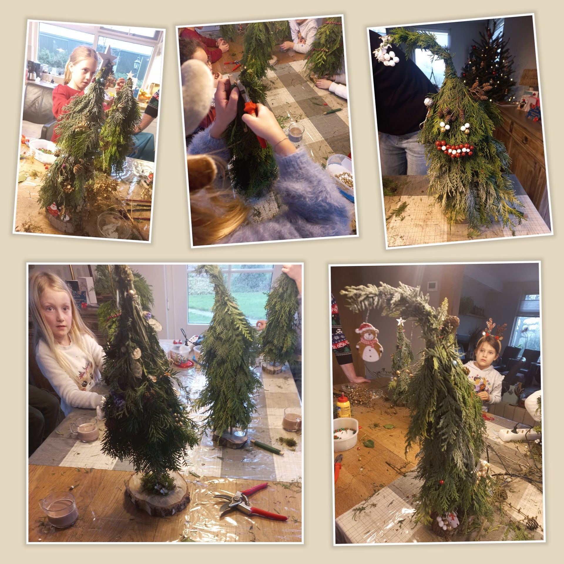 Mensen die binnenshuis decoratieve groenblijvende bomen maken.