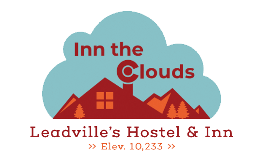 A logo for inn the clouds leadville 's hostel and inn