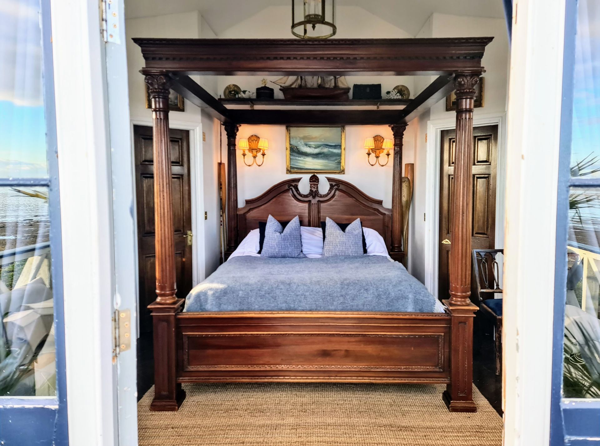 The super-king sized four-poster bed of the lodge at the West Usk Lighthouse.