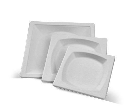 Stacked white square foam trays on a white background