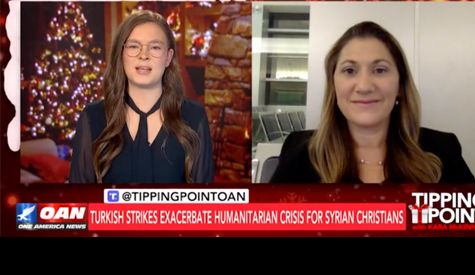 Non Profit: Two women are standing next to each other on a television screen.