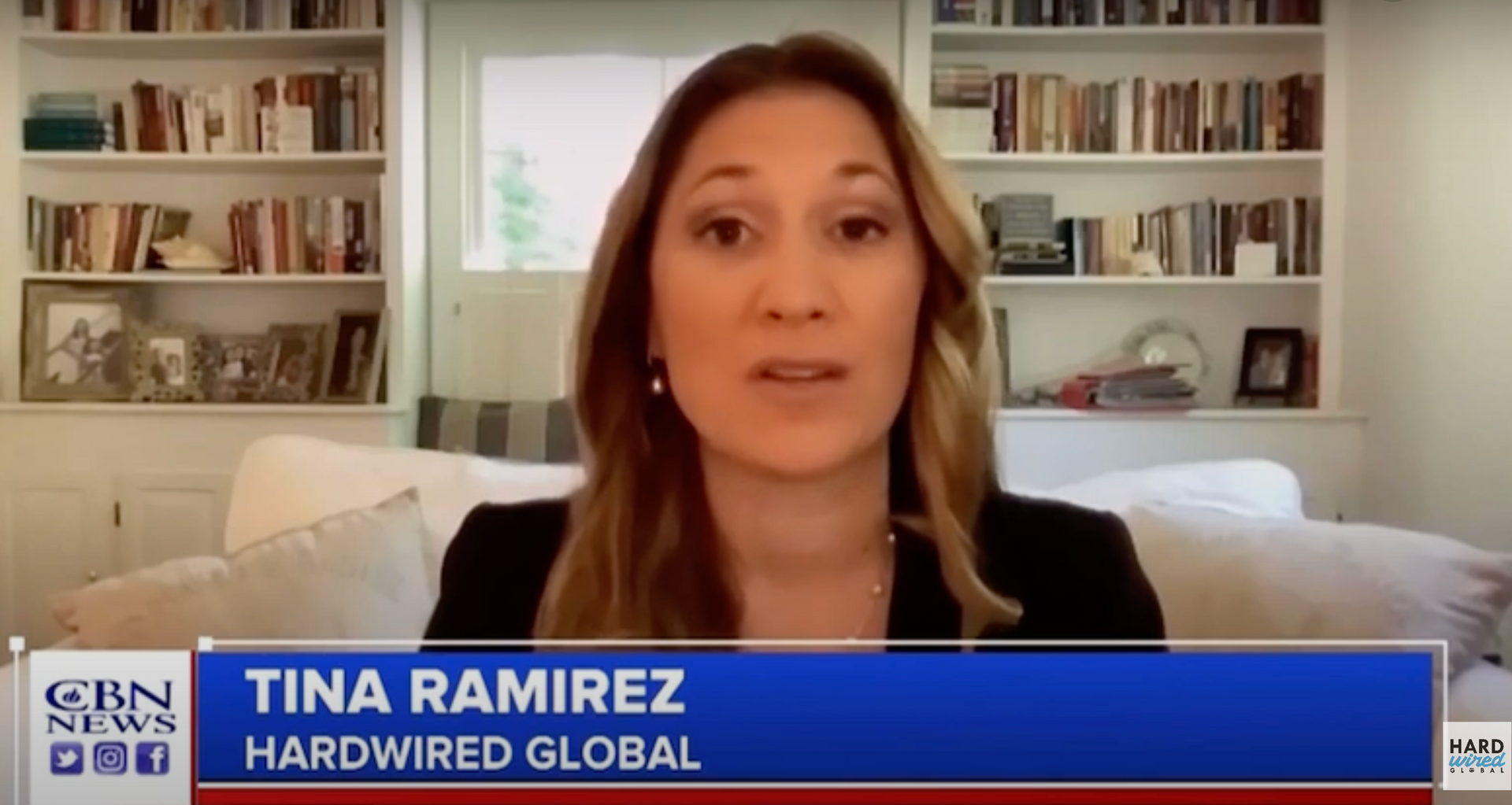 Non Profit: A woman is sitting on a couch talking on cbn news