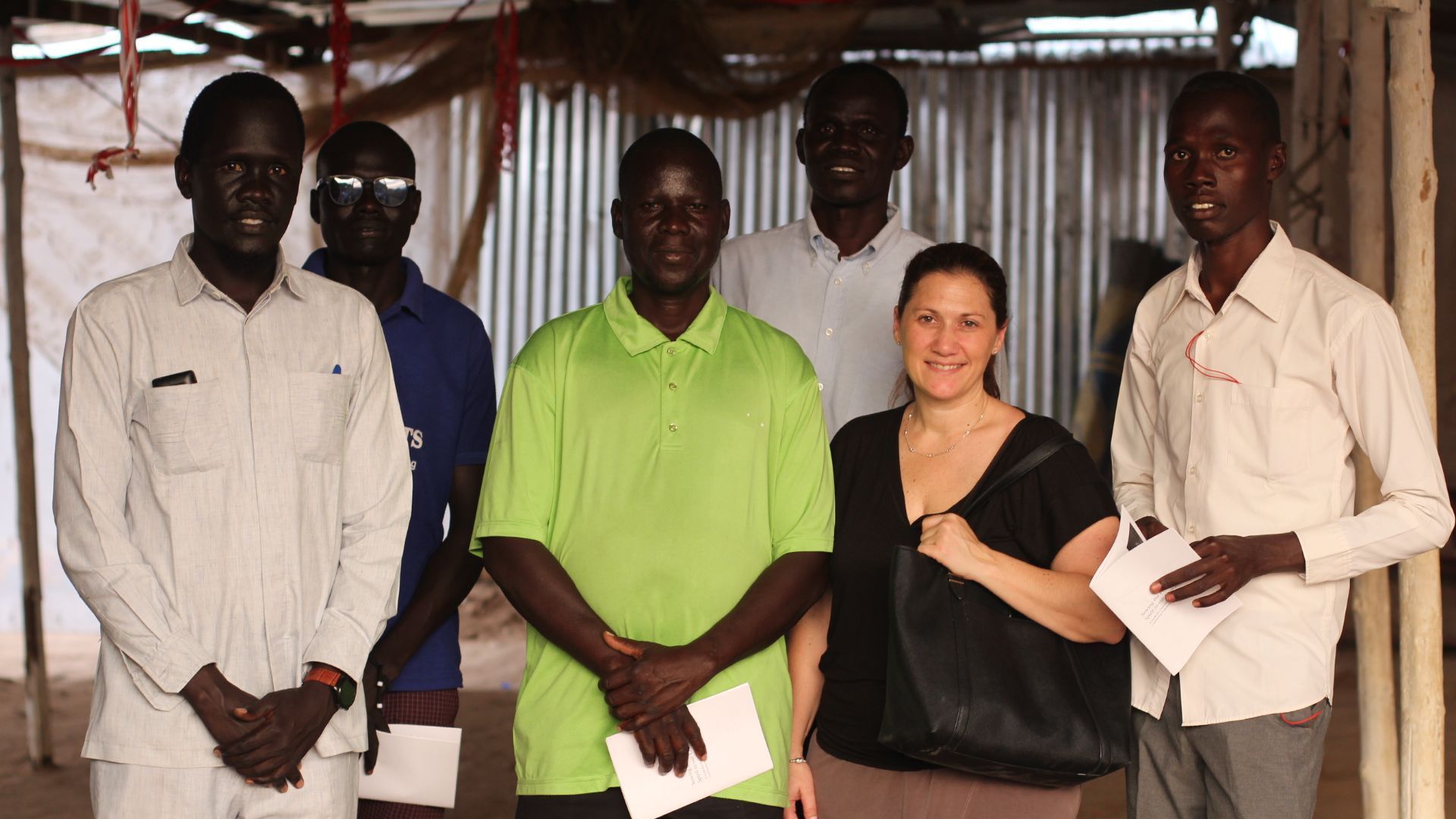 Non Profit Organization for Human Rights: A group of people standing next to each other in a room