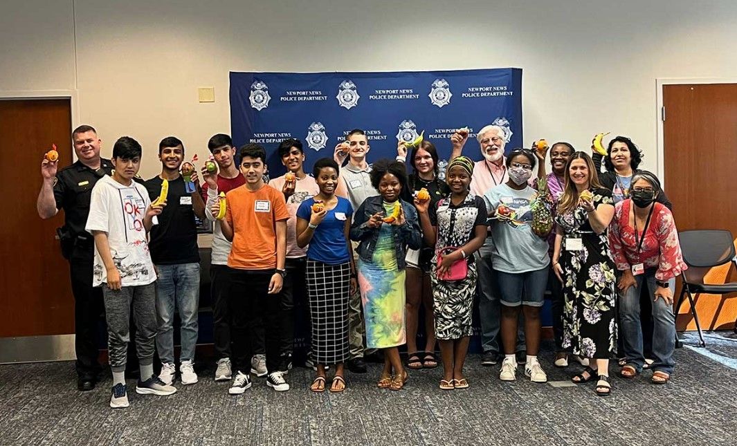 Human Rights Programs: A group of people are posing for a picture in a room.