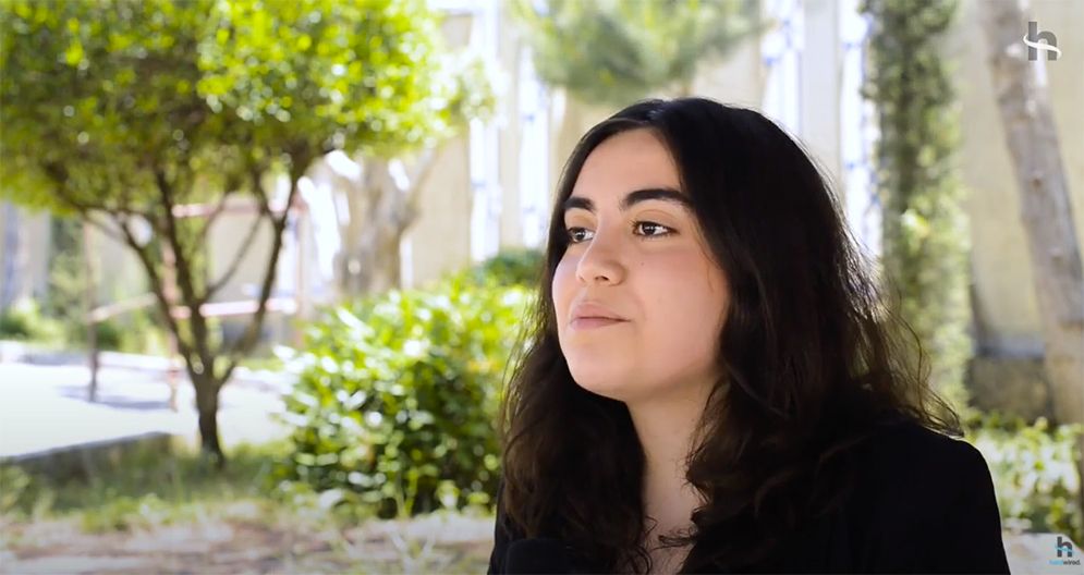 civil society & religious freedom: A close up of a woman 's face with trees in the background.