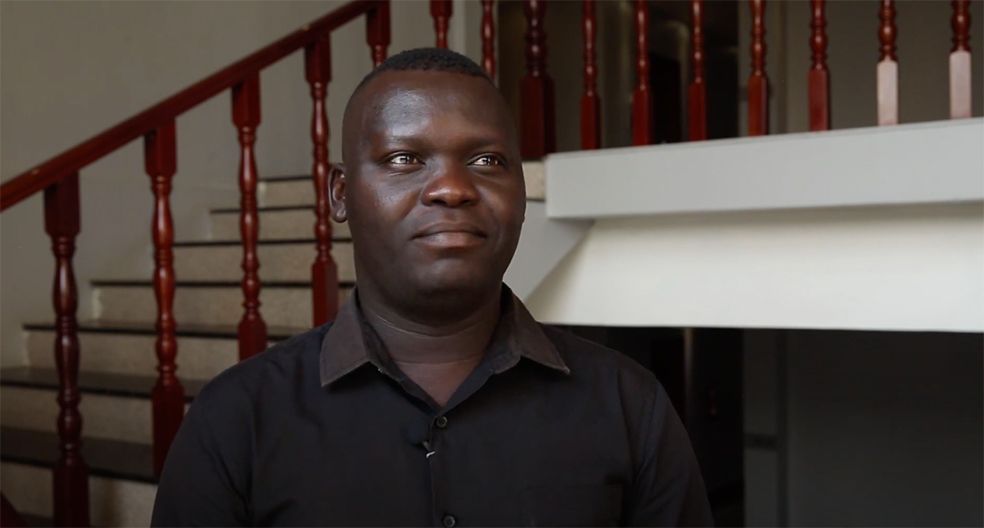 civil society & religious freedom: A man in a black shirt is standing in front of stairs