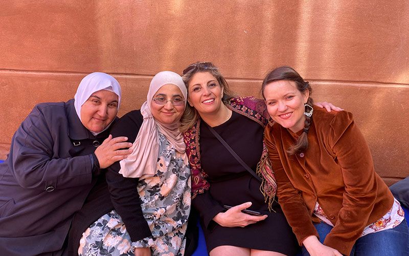 Human Rights Education: A group of women are posing for a picture together.