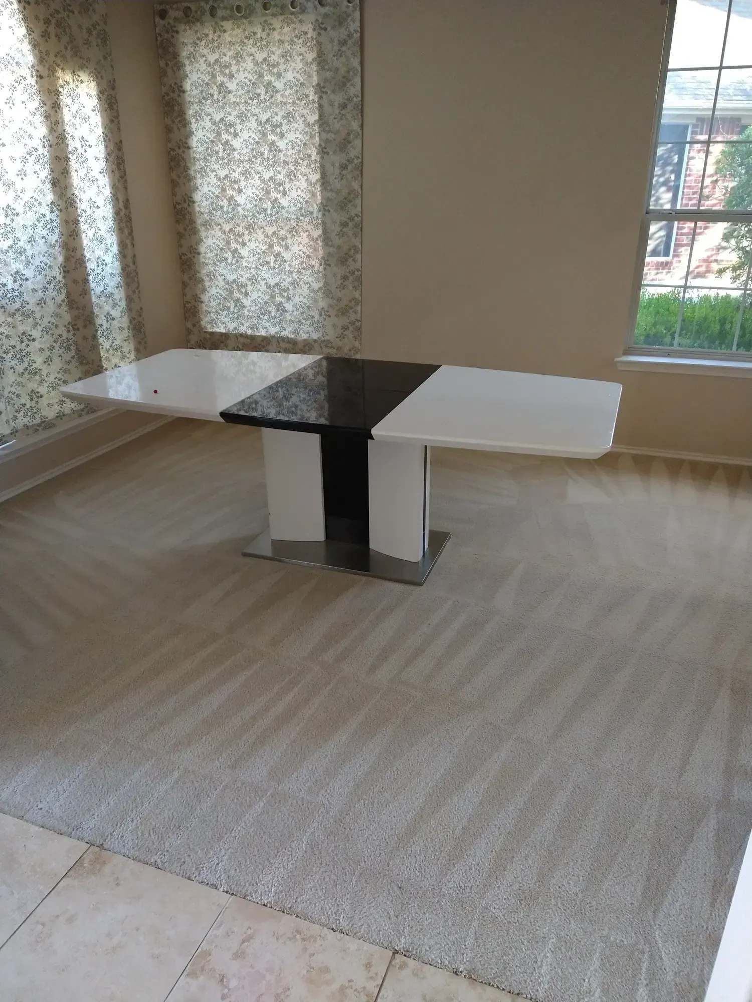 MB Carpet Cleaning- A black and white table in a room with a rug