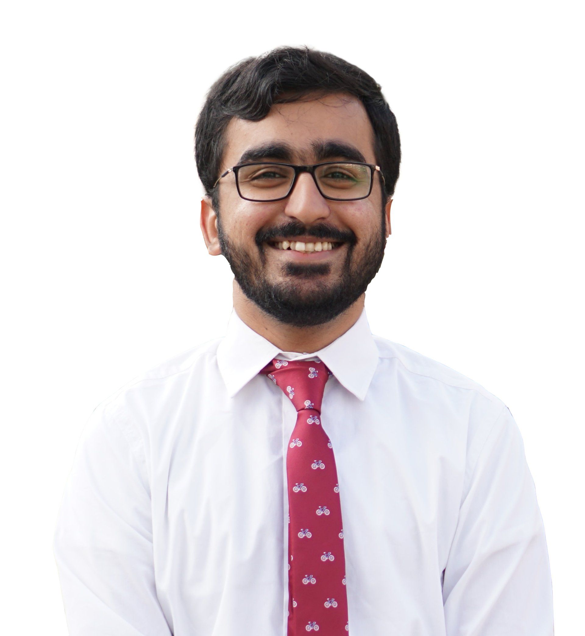Man wearing glasses, white shirt, and patterned red tie, smiling.