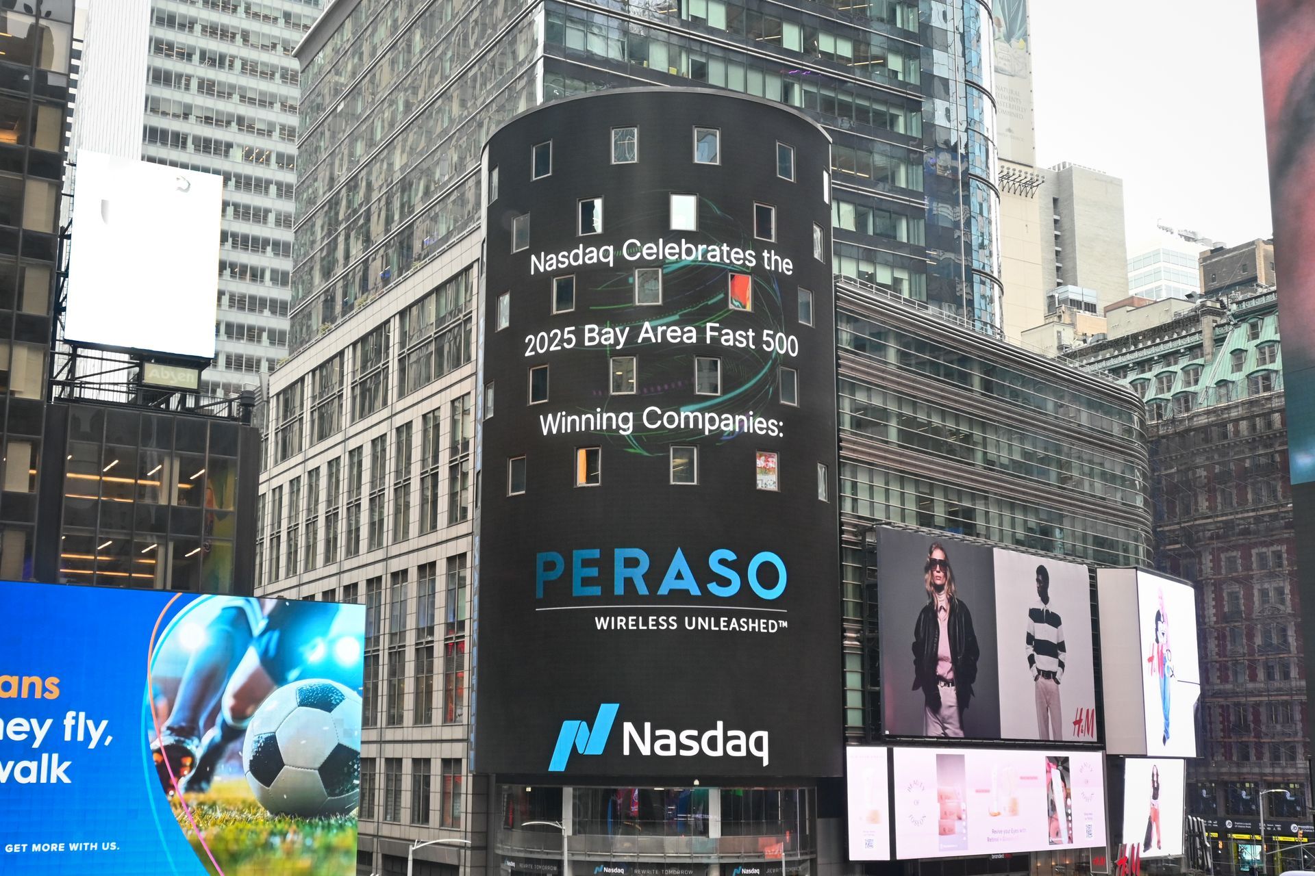 The Nasdaq cylindrical billboard in Times Square displays a congratulatory message for Peraso, a Nasdaq-listed company.