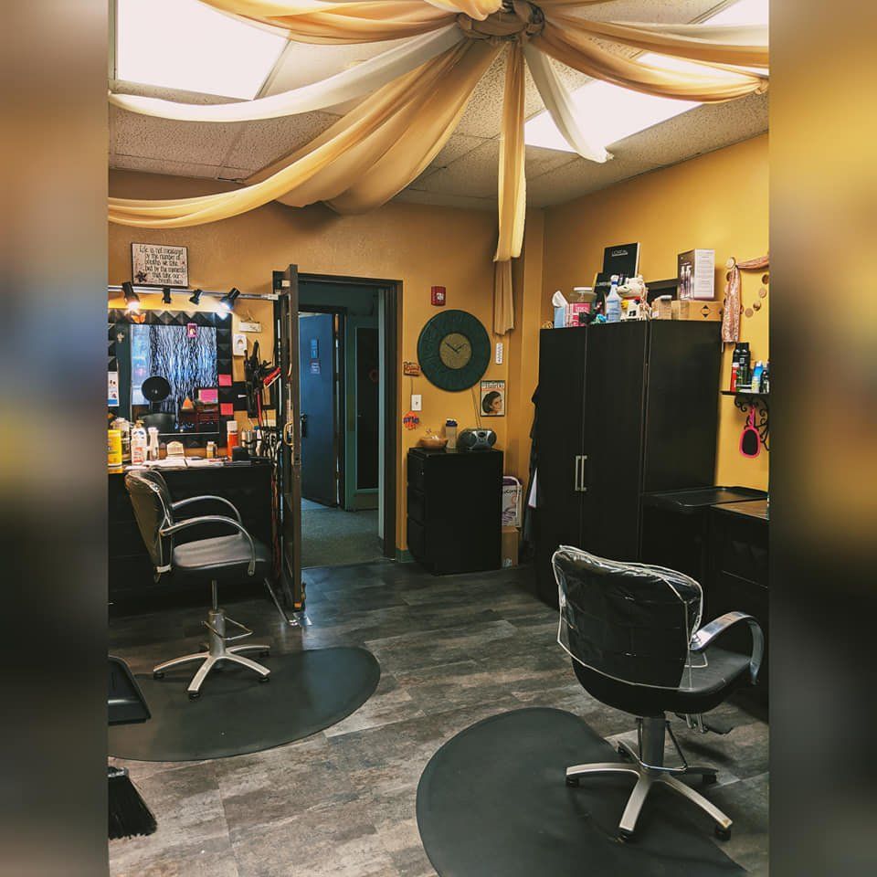 A picture of a hair salon with a clock on the wall