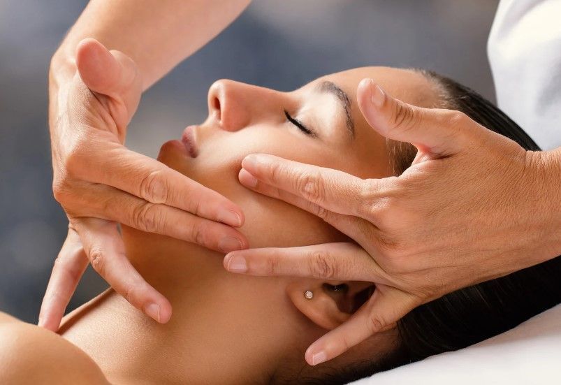 A client relaxing during a facial massage at The Skinutrition Clinic in Coventry