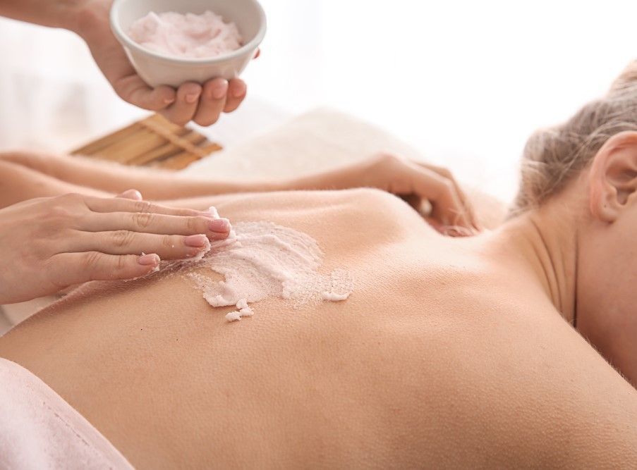 The Skinutrition Clinic exfoliating back body scrub as part of spa treatment in Coventry