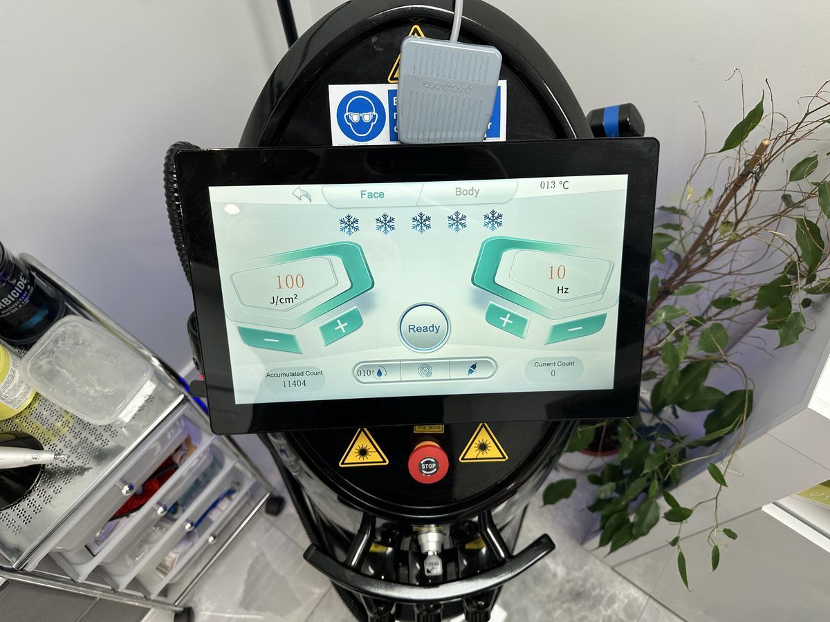 The hair removal screen on the laser at The Skinutrition Clinic, with face and body modes and cooling settings