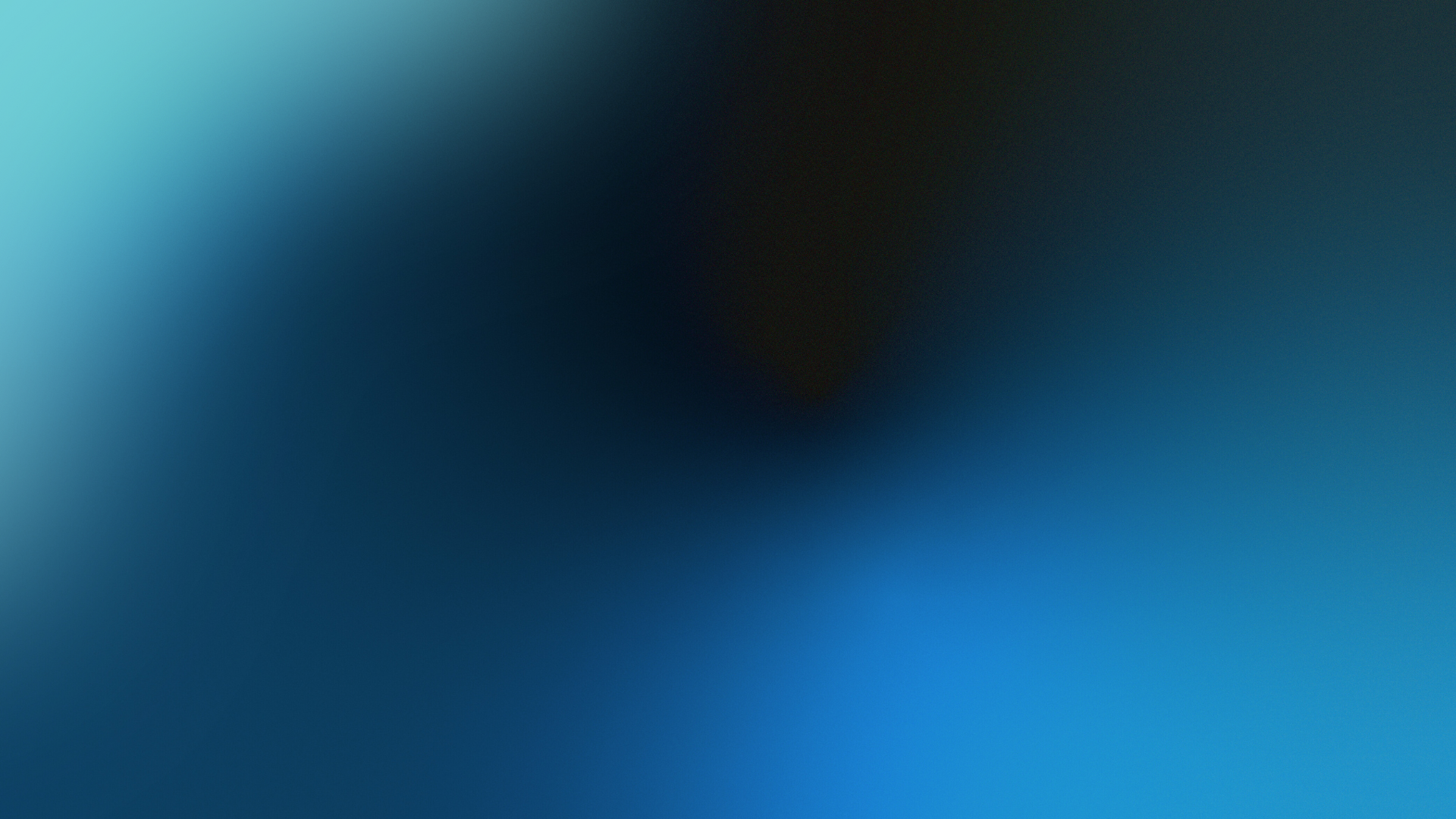 Abstract blue and black blurred gradient with a bright cyan glow in the lower right