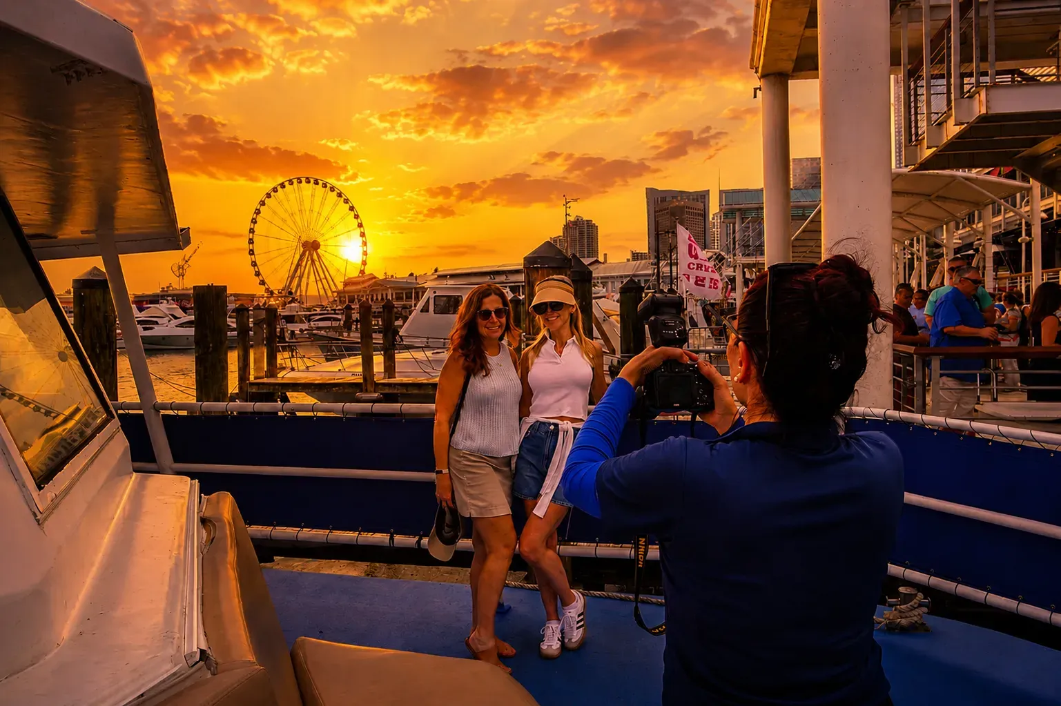 Guests taking photos during a Miami Sunset Cruise at Bayside Marketplace during golden hour