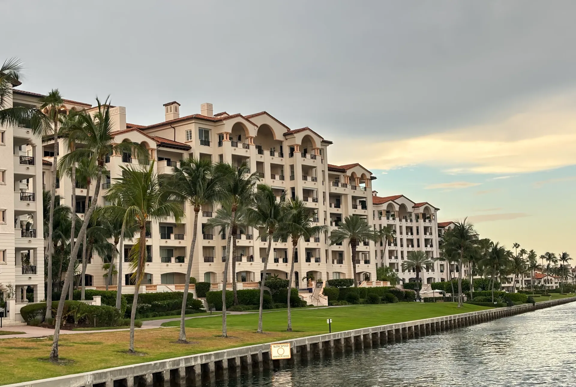 Luxury waterfront residences on Fisher Island viewed from the water during a  Miami cruise.