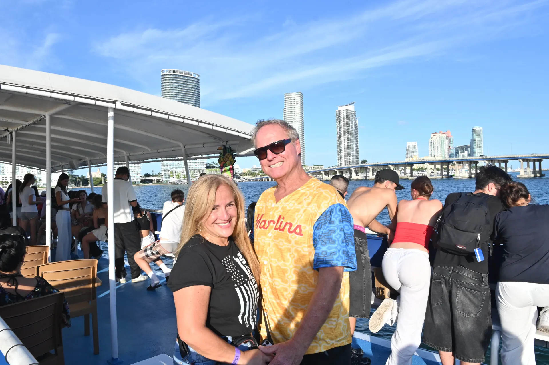 Couple enjoying the 10:30 AM Miami morning sightseeing cruise with waterfront views.