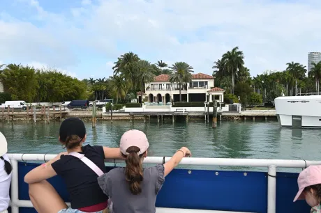 Celebrity homes on Miami boat tours with waterfront mansion on Star Island