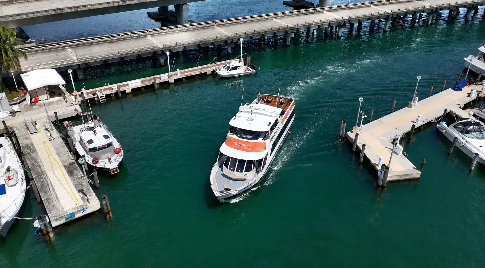 Miami boat tour with Mojito Bar onboard cruising Biscayne Bay.