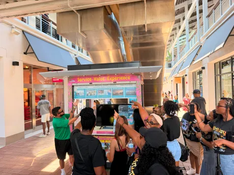 Guests at the Miami Boat Tours kiosk at Bayside Marketplace in Miami.