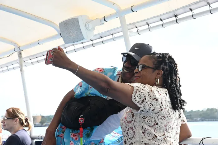 couple taking a selfie onboard Miami Boat Tours enjoying the sightseeing experience