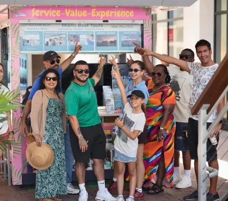 Visitors with the Miami Boat Tours team at the Bayside Marketplace kiosk.