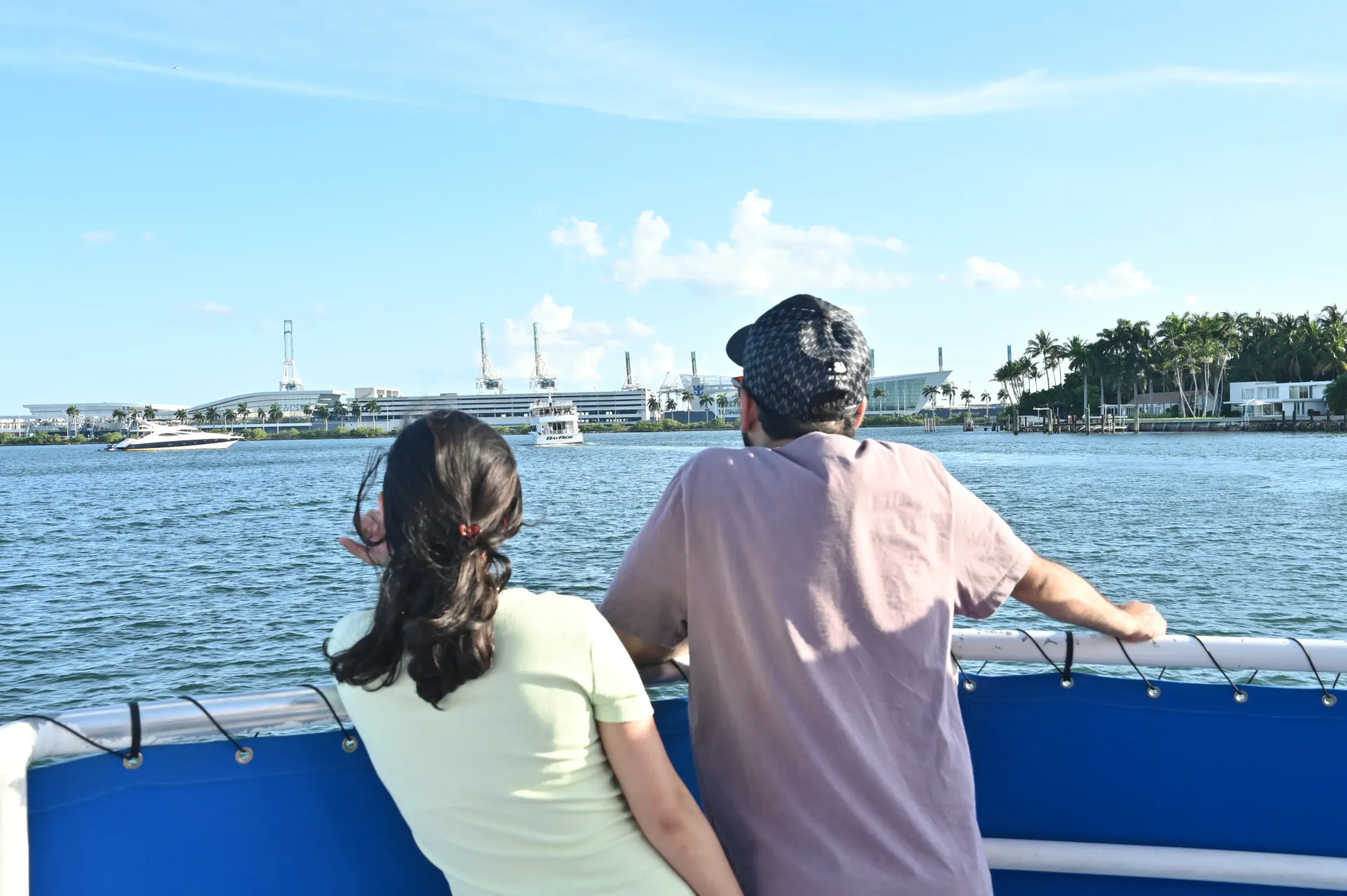 Passengers enjoying the Biscayne Bay boat ride route as the Miami Cruise Terminal comes into view before heading toward Star Island and the celebrity homes.