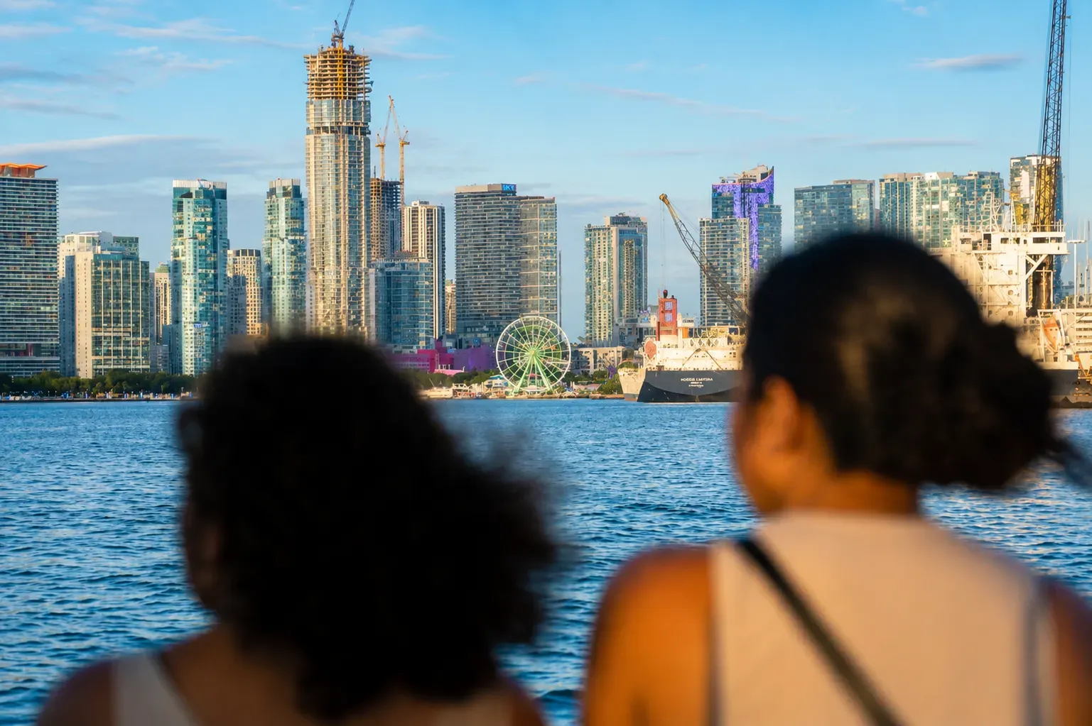 Miami Early Bird Special Cruises with morning views of the Waldorf Astoria rising above the Miami skyline.