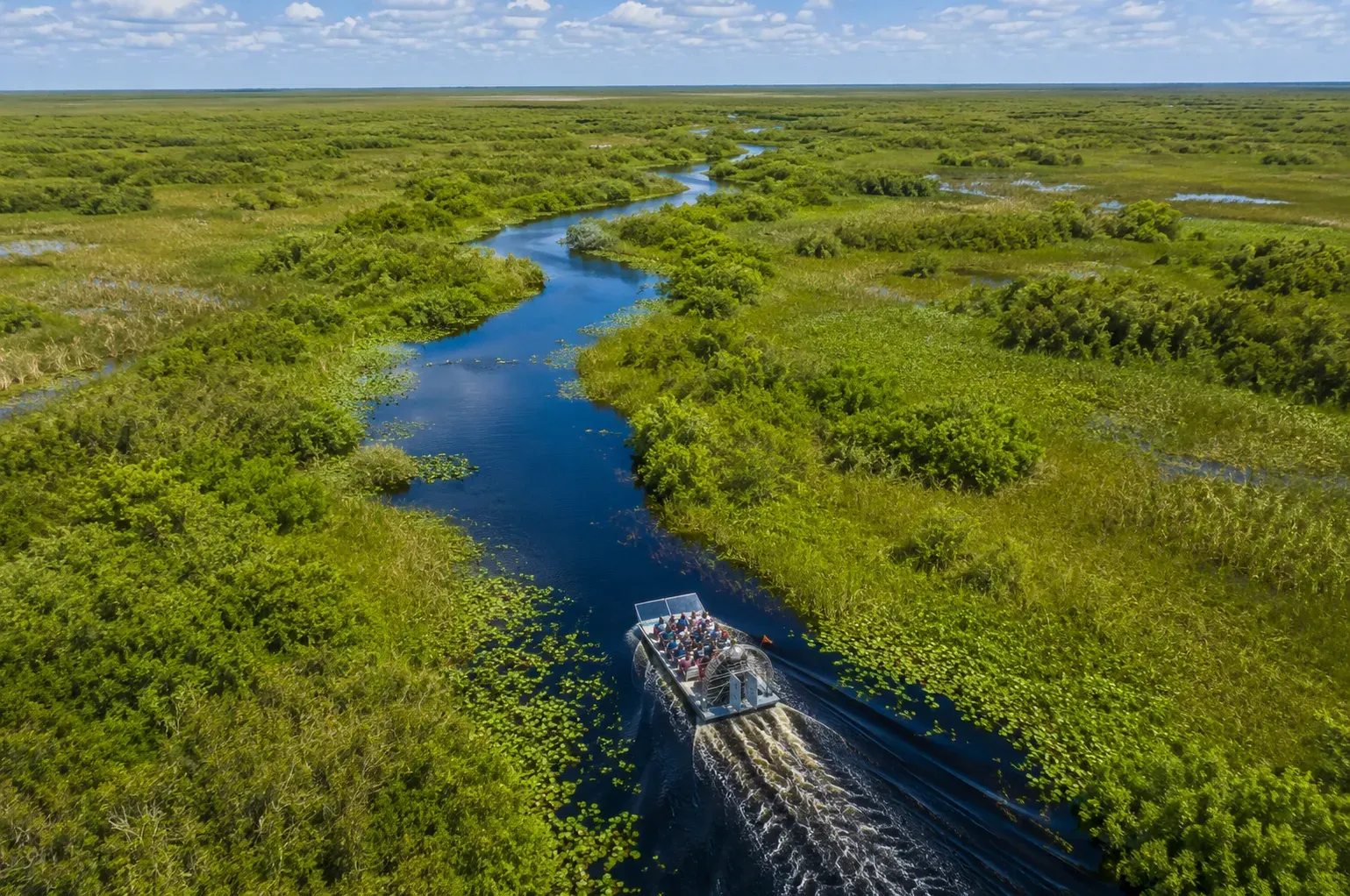 Aerial drone view of a Miami Everglades tour exploring the vast wetlands of the Florida Everglades