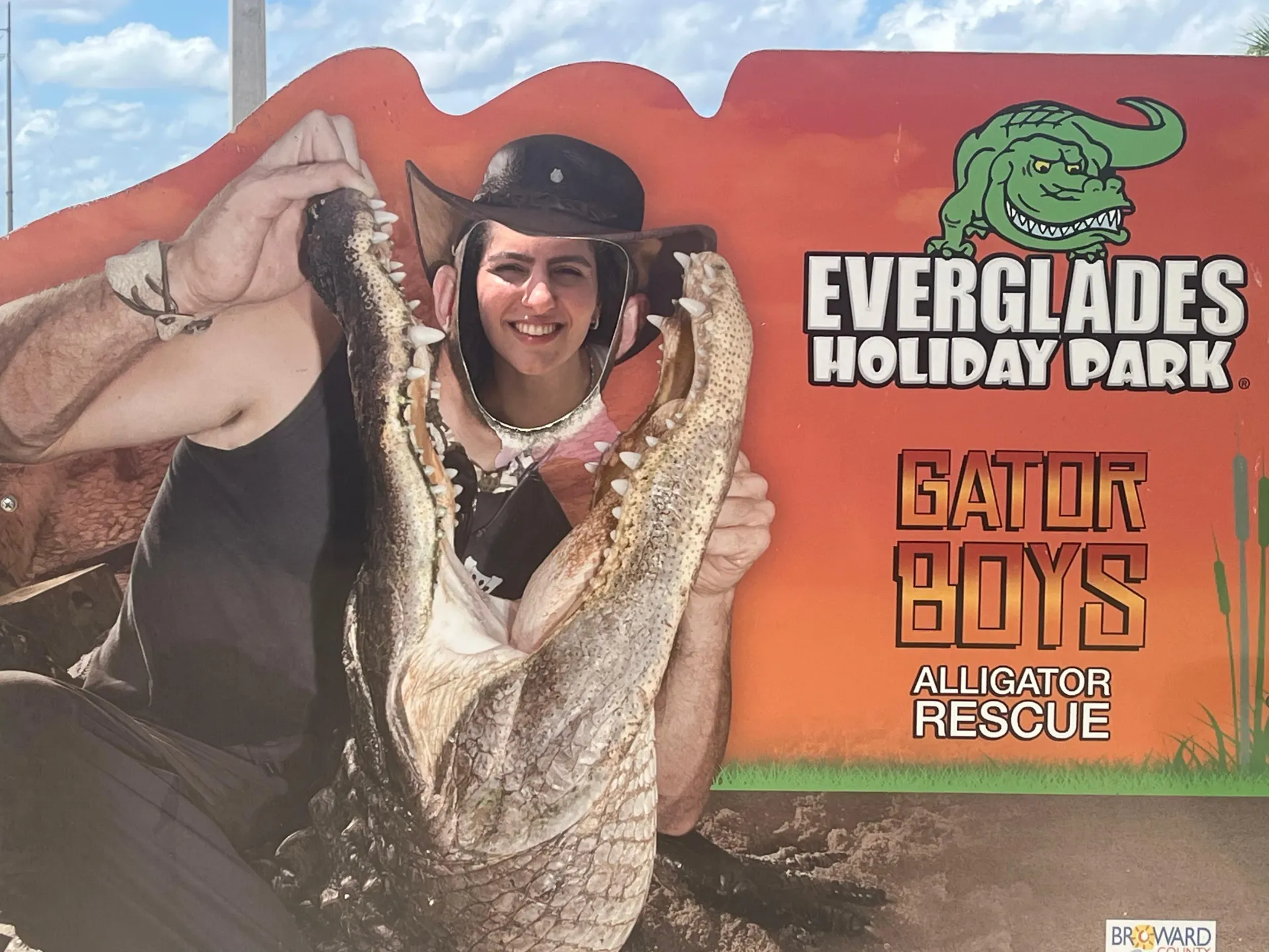 Guest posing with a rescued alligator during the live gator show on Miami Everglades Tours
