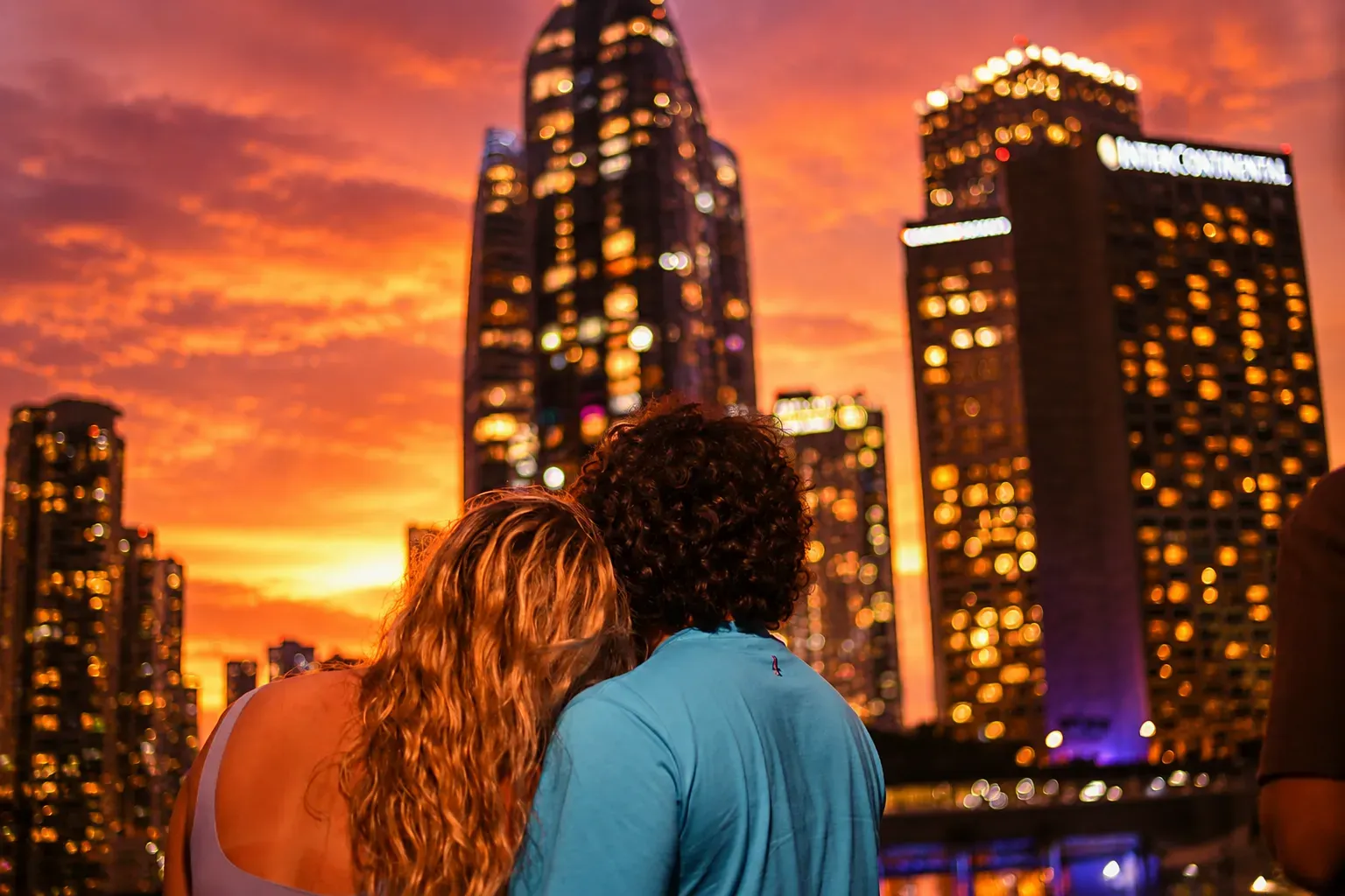 Couples enjoying romantic skyline views during a Miami Sunset Cruise at golden hour
