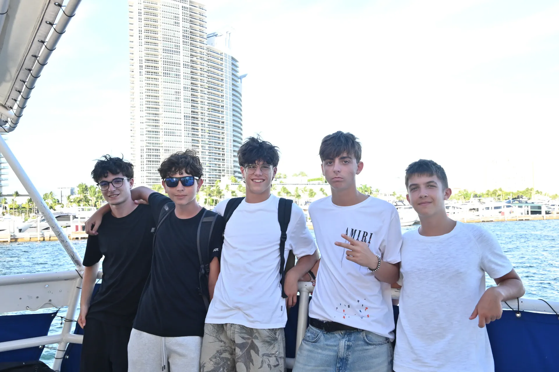 Friends enjoying the Miami sightseeing route with waterfront views during a boat cruise on Biscayne Bay.