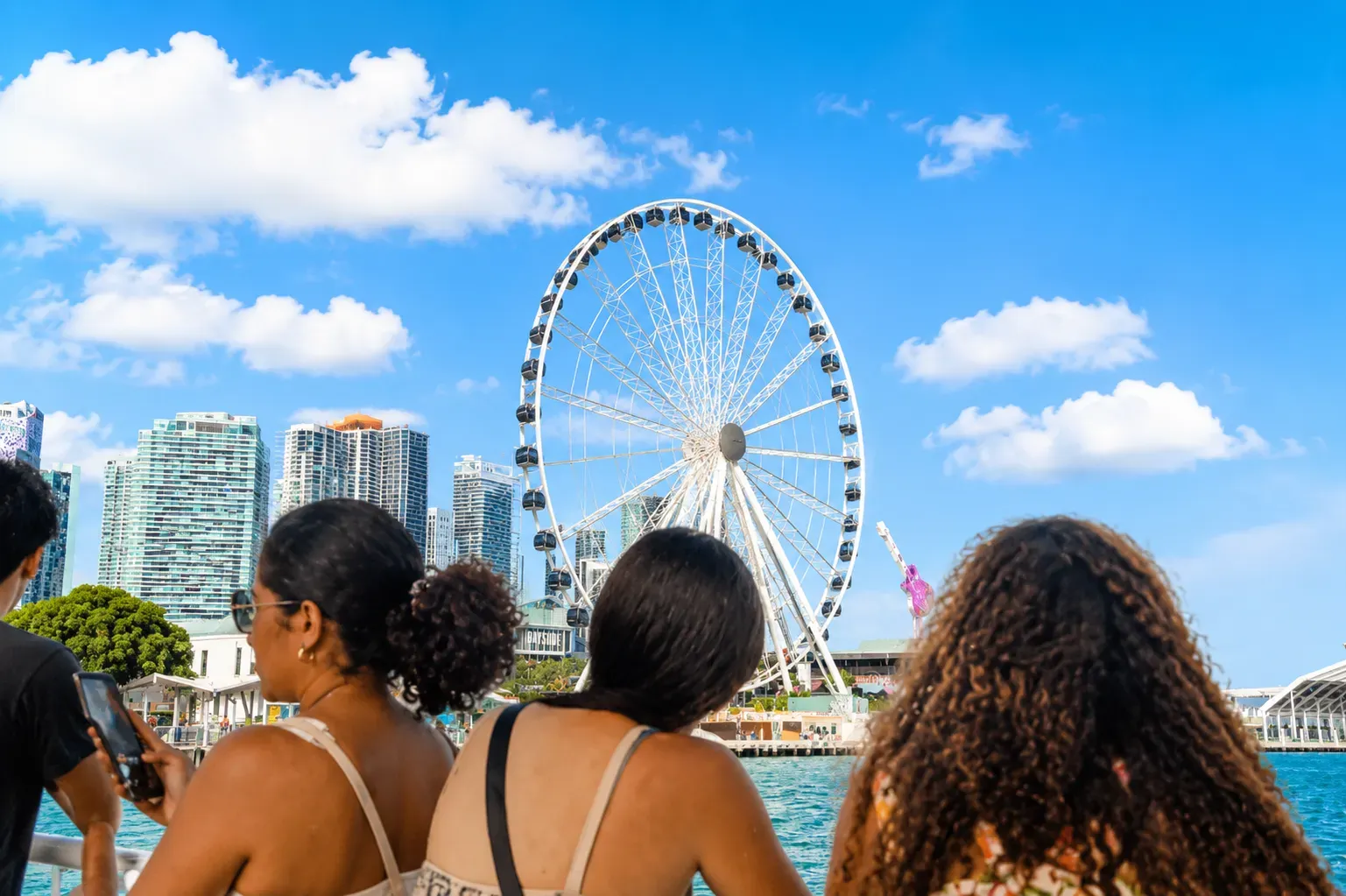 Miami Skyline Early Bird Cruise passengers enjoying morning views of Bayside Miami.