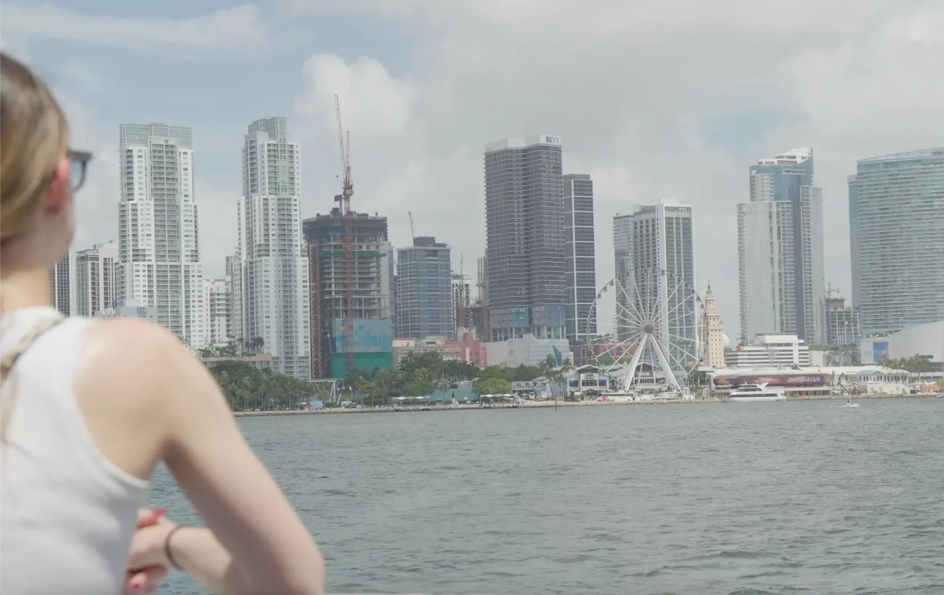 Passenger photographing the Downtown Miami skyline from Biscayne Bay.