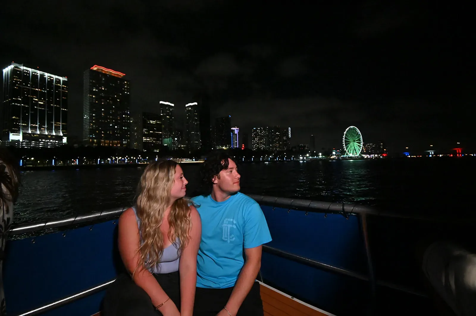 Couple enjoying a Miami staycation at night on Biscayne Bay.