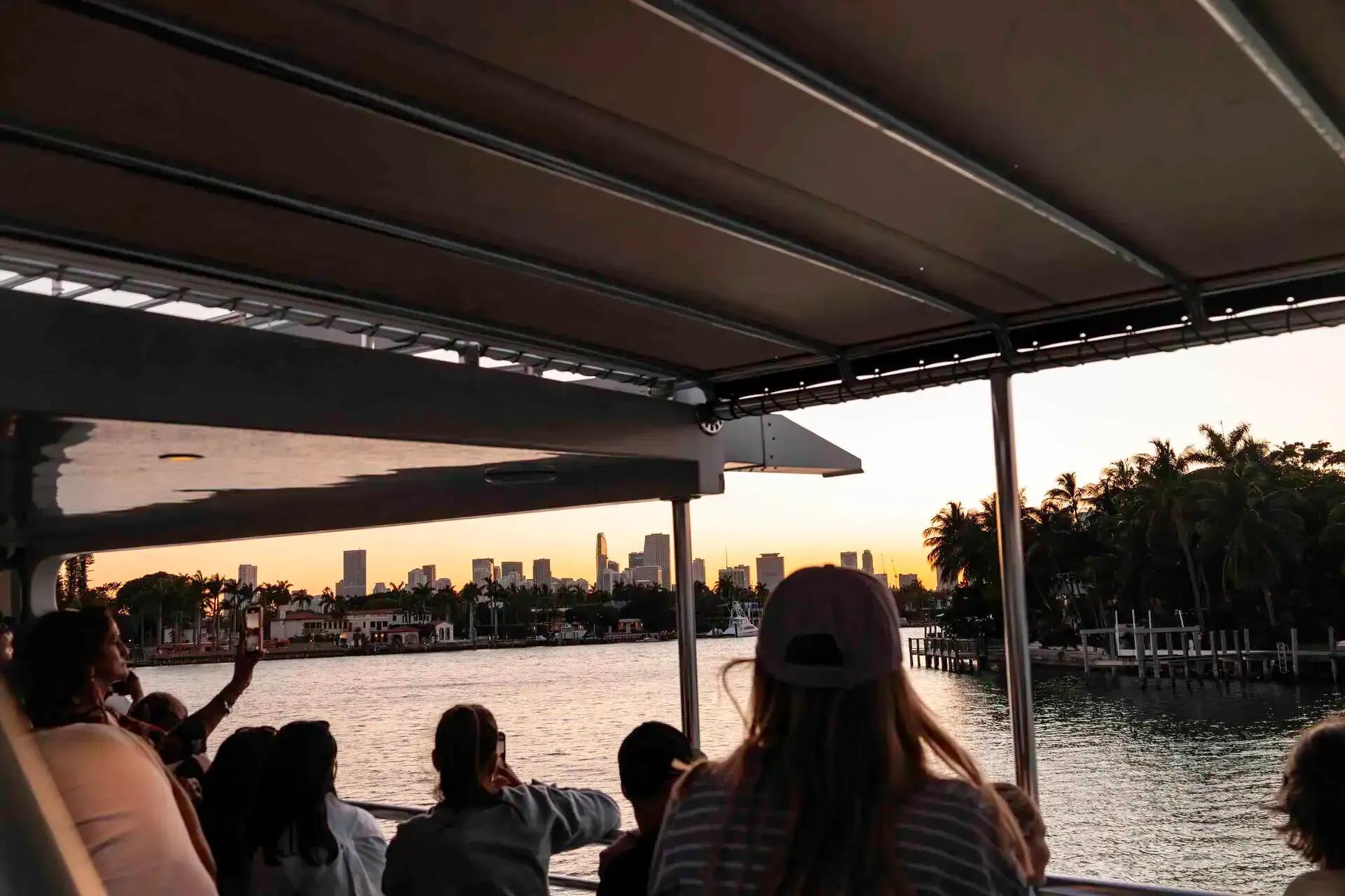 Passengers viewing celebrity homes from a sightseeing cruise on Biscayne Bay