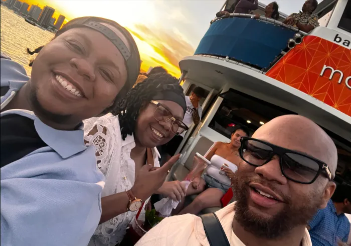 Guests enjoying a Miami sunset cruise on Biscayne Bay with skyline views and sunset scenery