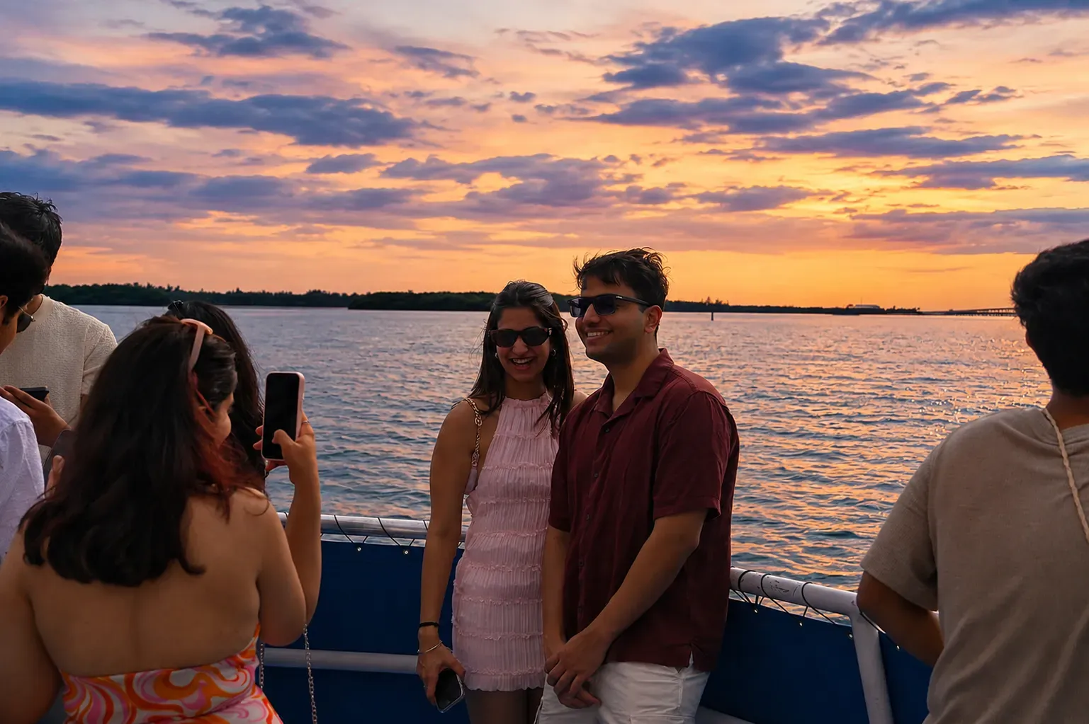 Guests enjoying a Miami Sunset Sightseeing Boat Cruise during golden hour on Biscayne Bay