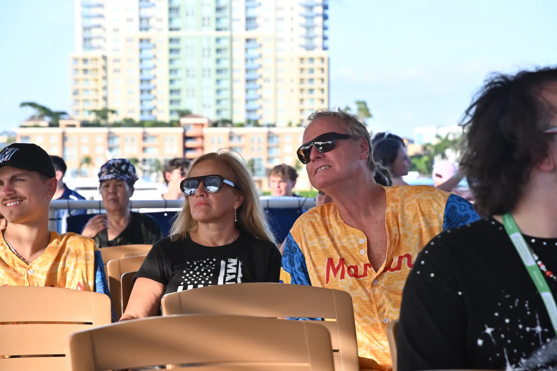 Passengers enjoying open-air top deck seating on an early bird cruise from Bayside Marketplace in Miami.